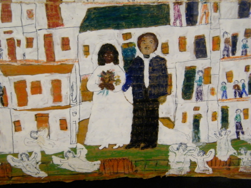 A crayon and pencil drawing of a Black woman in a white wedding dress stands with a White man in a black suit. They are in front of a an apartment building with lots of small figures around them.