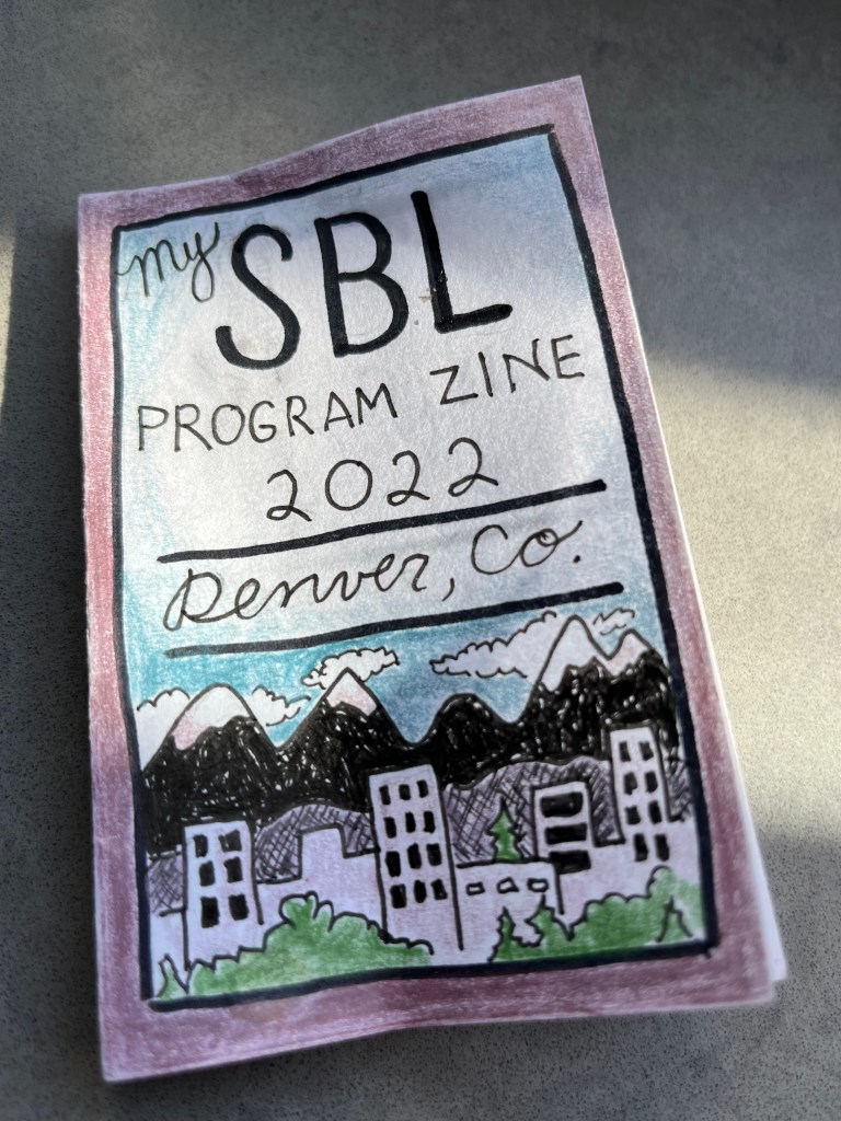 Small zine with "SBL Program Zine" on it. From 2022.